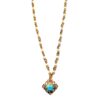 A gold chain with a blue stone and diamond shaped pendant.