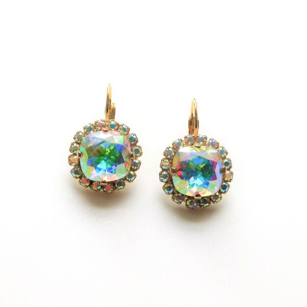 A pair of earrings with a large square stone.