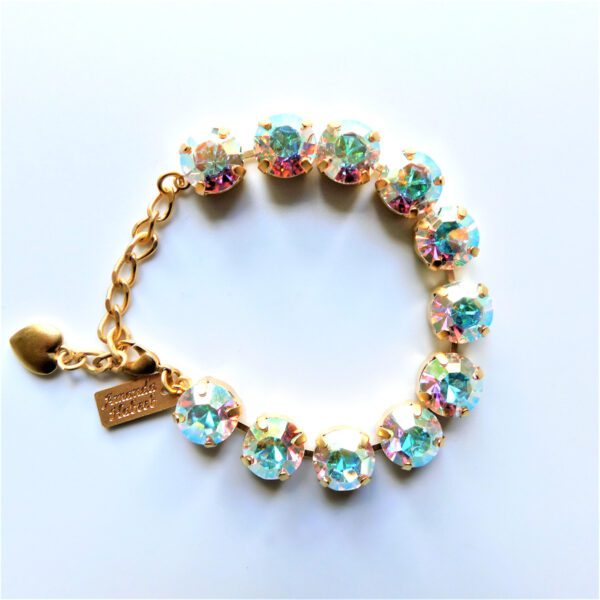 A bracelet with flowers and a gold chain.