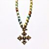 A necklace with a cross on it