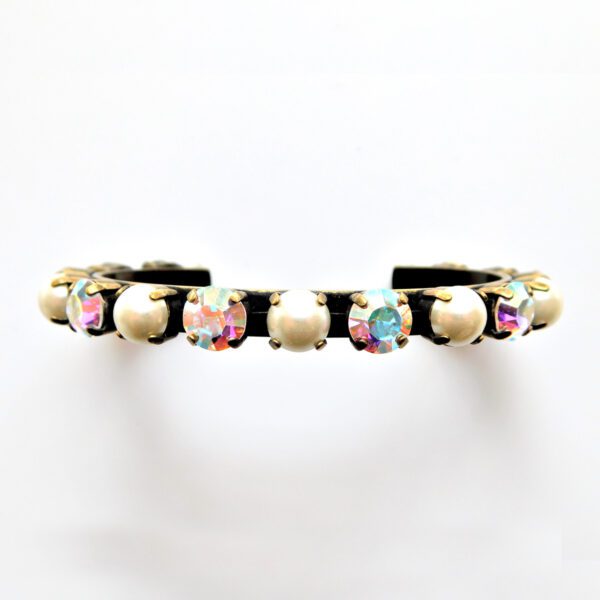 A bracelet with colorful stones and pearls.