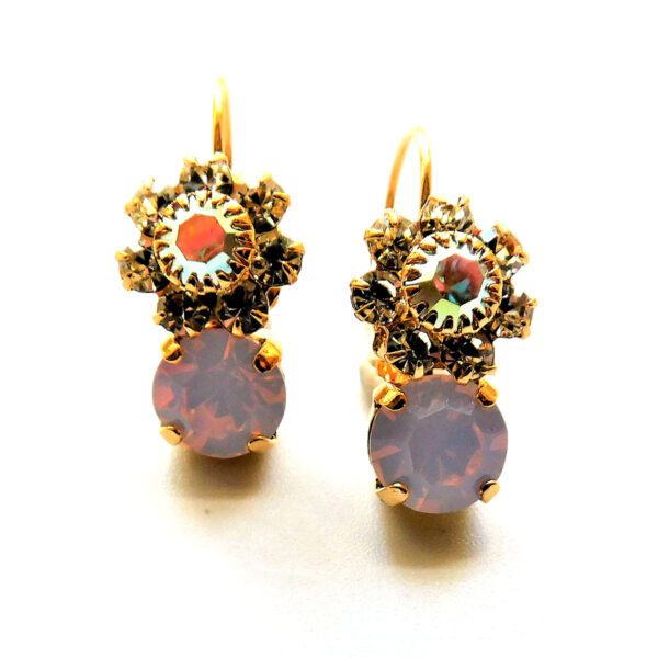 A pair of earrings with pink and orange stones.