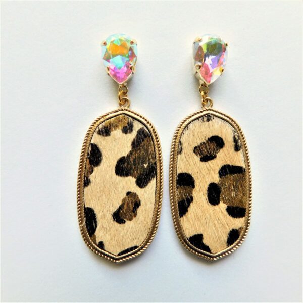 A pair of earrings with leopard print and iridescent stones.