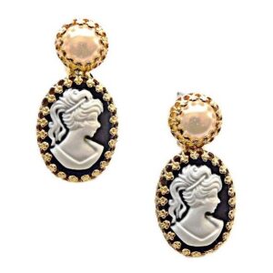 A pair of earrings with pearls and a cameo.