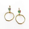 A pair of gold earrings with pink and green stones.