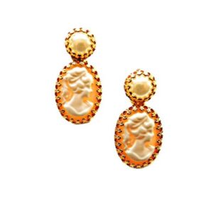 A pair of gold earrings with a cameo on them.