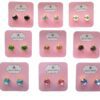 Colorful stud earrings on pink cards.