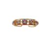 Gold ring with colorful gemstones.