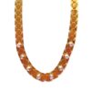 Golden necklace with hexagonal design and gems.