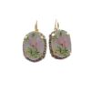 Gold earrings with floral design and stones.