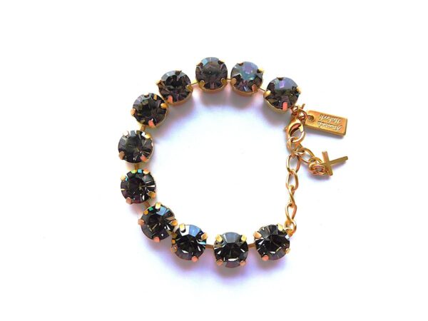 Black crystal bracelet with golden accents.