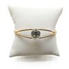 Gold ring with a large diamond centerpiece.