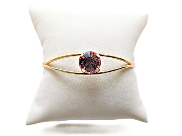 Gold ring with a round gemstone display.