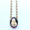 Vintage cameo necklace depicting mother and child.