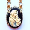 Cameo pendant of mother and child.