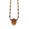 Gold necklace with religious pendant and gems.