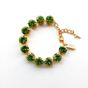Green rhinestone bracelet with gold cross charm