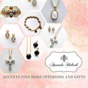 Assorted cameo and cross jewelry on pink