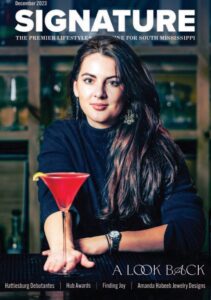Woman on magazine cover holding red cocktail